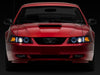 Raxiom 99-04 Ford Mustang Dual LED Halo Projector Headlights- Black Housing (Clear Lens)